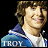 Two distinct pixelated portraits of young people with text labels, displayed in a against dark backgrounds