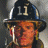Pixelated image of a firefighter in uniform with helmet marked '11' on left, green text 'OriginalIcons.com' on right.