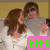 Two people in close proximity with brown hair, one wearing a gray shirt and the other white; pink rectangle with green text 'BFF9' at bottom right.