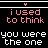 A black background displays pink and white pixelated text in a of five , with the top showing 'i used to think you were the one' repeated