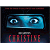 Pixelated static icon featuring a blue rectangular object with two circular eyes, red text below, and dark background.
