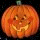 Animated pumpkin face with carved eyes and mouth, orange skin texture, black background, multiple size variations of the same frame.