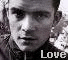 Black-and-white image of a person with short hair wearing dark clothing, repeated in two with 'Love' text below each instance