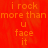 Red background with orange text reading "i rock more than more than u face it" in a pixelated font, partially obscured by a gray rectangle.