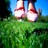 Pixelated image of two figures standing on grass with blue sky background, wearing white and red footwear.