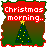 Animated Christmas-themed icon with red text reading "Christmas morning.." and "I will unwrap you and play with you!" over a green tree on brown background.