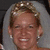 Pixelated image of a smiling person with light hair and earrings on left, next to yellow background with blue text reading 'best teacher Ever!!!'