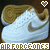 White Nike Air Force One sneakers with gold swooshes and brown accents, displayed in a with pixelated text and heart icons above each shoe
