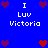 Blue background with white text reading "I Luv Victoria" and pixelated hearts in red and purple arranged around the text.