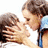 A static image shows two people kissing with blue pixelated text surrounding them on a white background.