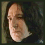 Three pixelated views of a person with long dark hair against a muted background, showing different facial angles and expressions.