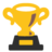 Pixelated golden trophy with black base and yellow plaque, featuring two side handles and a brown vertical mark on the cup.