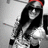 Pixelated static image of a figure with long dark hair, wearing a red headband and white top against gray background.