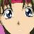 Close-up of a character's face with large blue eyes, light skin, and a small mole on the cheek, rendered in pixelated anime style.