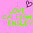 Pixelated text on pink background with green letters and a purple heart symbol above the text.