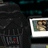 Pixelated image showing a dark figure with cage-like structure, small screen displaying blurred figures, and red text on black background reading 'Hey Luke Here Is A Picture Of Me And Your Mother Check It Out Son'