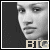 Pixelated grayscale portrait of a person with dark hair, side profile facing left, against a solid black background.