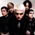 Group of people in black clothing with white hair, text changes from 'My Chem' to 'Is Love' and red hearts appear.