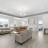 Pixelated static image of an interior space with light-colored walls, a dark horizontal trim line, and indistinct furniture shapes.