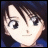 Pixelated anime-style character face with dark hair and blue clothing, next to stylized text on black background.