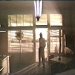 Static pixelated image of a person standing in front of large windows with light streaming through, viewed from an interior space with visible ceiling fixture and partial furniture.