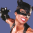 Pixelated static image of a person in Catwoman costume with raised arm, black mask, and red lips against blue background.