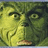 Green-skinned character with wide eyes and furrowed brows on left; red background with white pixelated text reading "you're a MEAN one" above, "Mr. Grinch..." below-left, and "but i love you anyway<3" below-right.