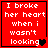 Red background with white pixelated text reading "I broke her heart when i wasn't looking" and a black heart symbol at the bottom right.