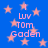 Blue background with pink stars and repeated text "Luv Tom Gaden" in pink pixelated font, arranged in a pattern with no visible motion changes
