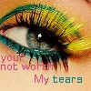 A close-up of a human eye with colorful eyeshadow and text overlay reading 'your not worth My tears' in pink and teal letters.