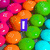 Pixelated candy background with colorful round shapes and purple text overlays showing 'I', 'Lovee', and partial phrases.
