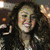 four pixelated images showing a woman with long brown hair in different poses and backgrounds