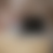 A pixelated gradient image with no discernible subjects or objects, featuring soft transitions between muted brown, gray, and beige tones.