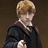 Pixelated image of a person with light brown hair in dark clothing against a brown background, next to red text reading "Weasley is My King! <3".