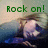 Green text 'Rock on!' appears above a pixelated figure with light hair and dark clothing in a blue-toned background.