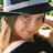 A pixelated image shows a person with light hair wearing a dark hat and black top, next to a red with white text reading "I Love Savanna!!"