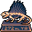 Pixel art of a bipedal dinosaur-like creature with a spined back standing on a pedestal with text.