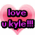 Pixelated pink heart background with purple text reading 'love u kyle!!!' in bold black-outlined letters.