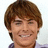 A pixelated image of a person with brown hair and a light-colored shirt on the left, next to a blue background with pink text on the right.