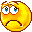 Yellow circular pixelated face with blue eyes and downturned mouth showing various expressions including tears, squinting, and closed eyes.