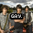 Three pixelated figures stand outdoors with a black banner displaying 'GAY.' in white text overlaid on the center.