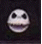 A circular white skull face with black eye sockets and nose cavity, displaying multiple mouth expressions against a dark background.