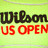 A split-screen icon with a green background on the left and black on the right, displaying text elements related to tennis championships.