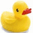 Yellow rubber duck with red beak and black eye on white background, adjacent to blue with pixelated yellow text