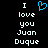 Pixelated text reads 'I love you Juan Duque' with a blue heart symbol above the word 'love', displayed on black background.