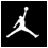 Static pixelated icon of a white silhouette figure in mid-air jump pose against solid black background with visible dithering and anti-aliasing artifacts.