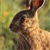 A pixelated animal with brown and black fur stands against a blurred green background, its head tilted upward with a light-colored underbelly visible.