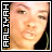Two side-by-side animated frames of a pixelated close-up portrait with text on the left edge, showing color variation in the text.