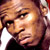 Pixelated close-up of a person's face with visible facial features and hair, rendered in warm tones on a dark background.