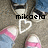 Pixelated image of a person with dark hair wearing a light-colored top with pink accents, overlaid with black text and a white heart outline.